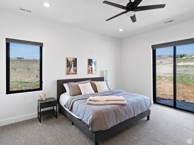 2971 S Sand Trap Cir Unit 64, Garden City, UT 84028 - carpeted bedroom featuring access to outside, ceiling fan, and multiple windows