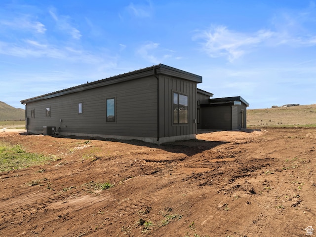 2971 S Sand Trap Cir Unit 64, Garden City, UT 84028 - view of side of property featuring central AC unit