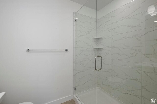 4119 S Winder Ward Dr E Unit 3-106, Millcreek, UT 84124 - full bathroom with a stall shower, toilet, and baseboards