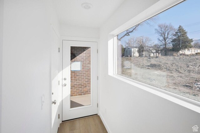 4119 S Winder Ward Dr E Unit 3-106, Millcreek, UT 84124 - entryway featuring wood finished floors and baseboards