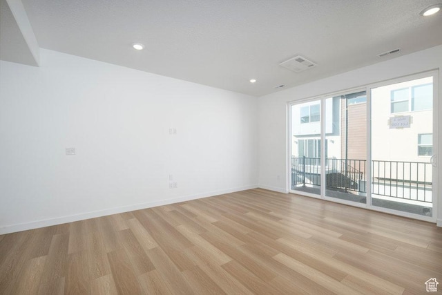 4119 S Winder Ward Dr E Unit 3-106, Millcreek, UT 84124 - unfurnished room with light wood-style flooring, baseboards, and recessed lighting