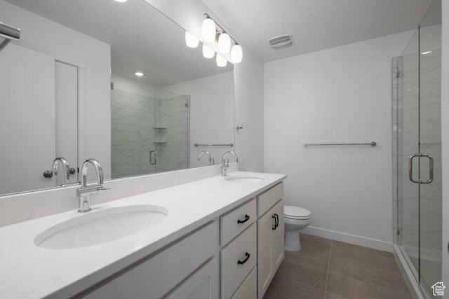 4119 S Winder Ward Dr E Unit 3-106, Millcreek, UT 84124 - bathroom featuring a stall shower, tile patterned flooring, toilet, double vanity, and baseboards