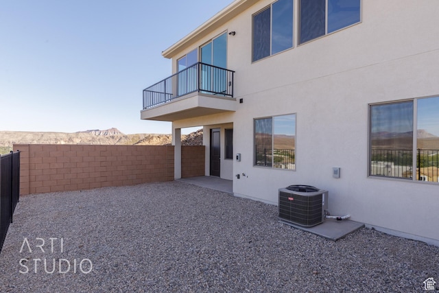 2086 W 320 S, Hurricane, UT 84737 - rear view of property with a balcony, central air condition unit, stucco siding, and a patio