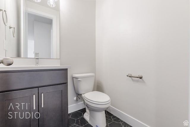 2086 W 320 S, Hurricane, UT 84737 - bathroom with toilet, vanity, baseboards, and tile patterned floors
