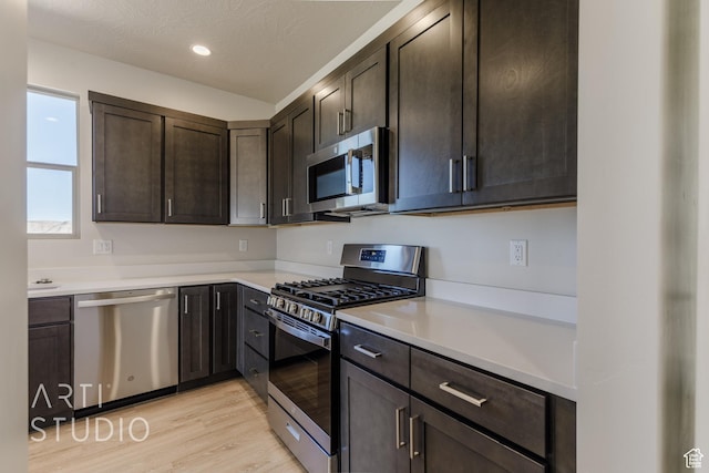 2086 W 320 S, Hurricane, UT 84737 - kitchen with appliances with stainless steel finishes, light wood-style floors, dark brown cabinets, light countertops, and recessed lighting