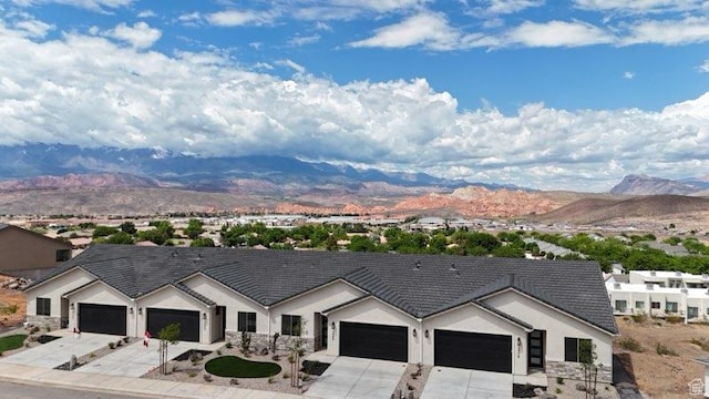 2086 W 320 S, Hurricane, UT 84737 - ranch-style house with a mountain view, driveway, and a garage