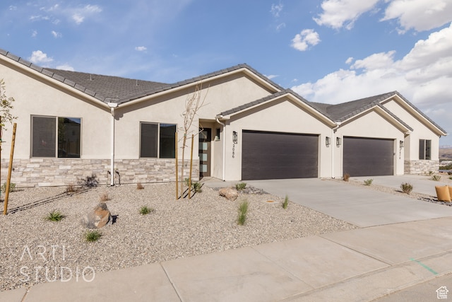 ranch-style house featuring a garage