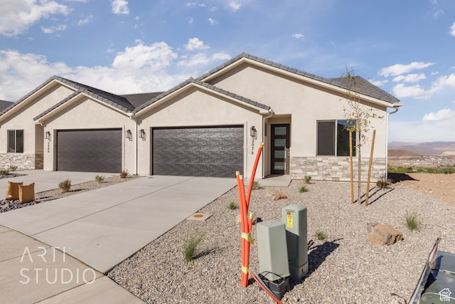 ranch-style house featuring a garage