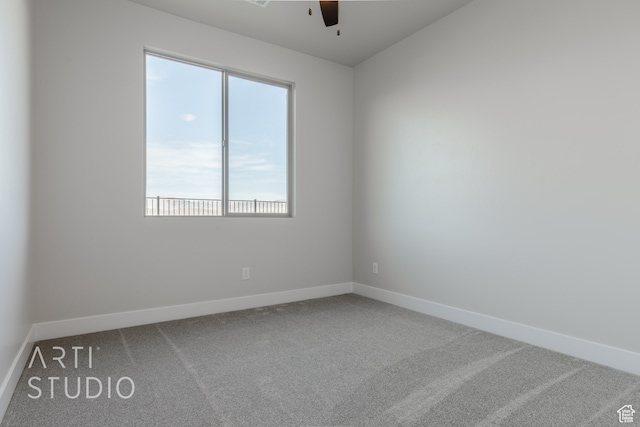 carpeted empty room with ceiling fan