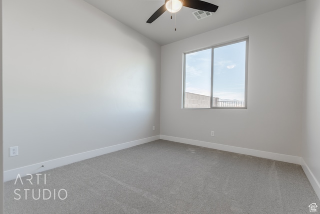 unfurnished room featuring ceiling fan and carpet floors