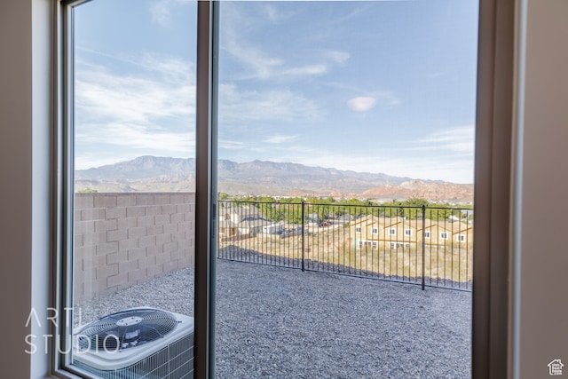 doorway featuring a mountain view and plenty of natural light
