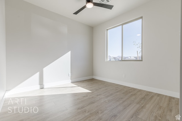 unfurnished room featuring light hardwood / wood-style flooring and ceiling fan