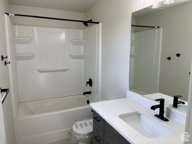 full bathroom featuring vanity, shower / bath combination, and toilet