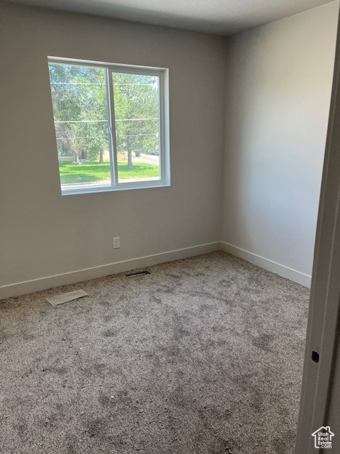 view of carpeted spare room