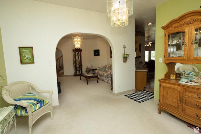 interior space featuring an inviting chandelier and light carpet