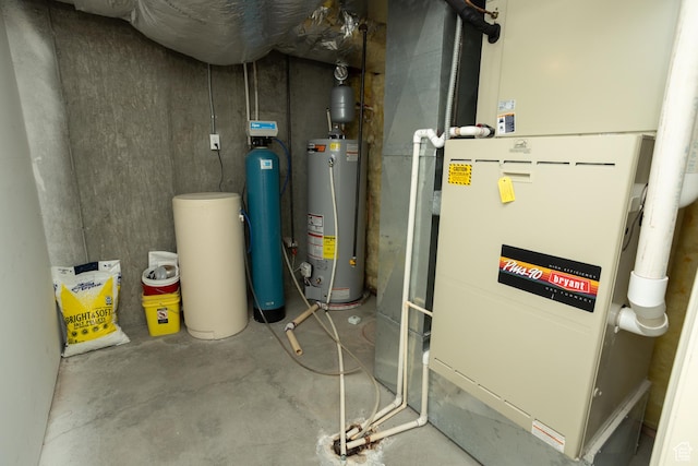 utility room featuring heating unit and water heater