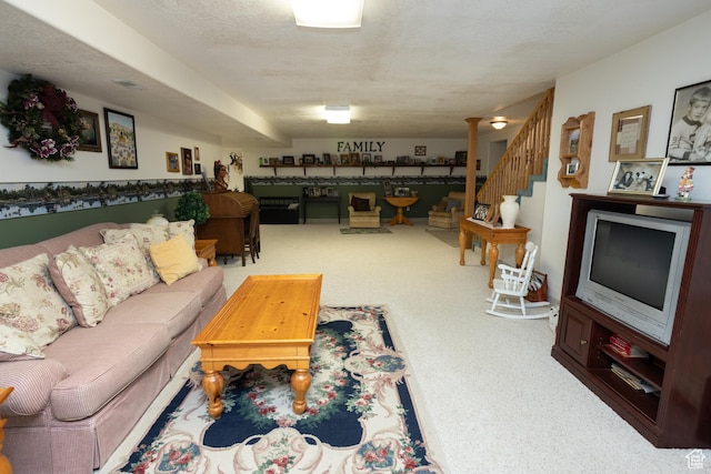 carpeted living room with a textured ceiling