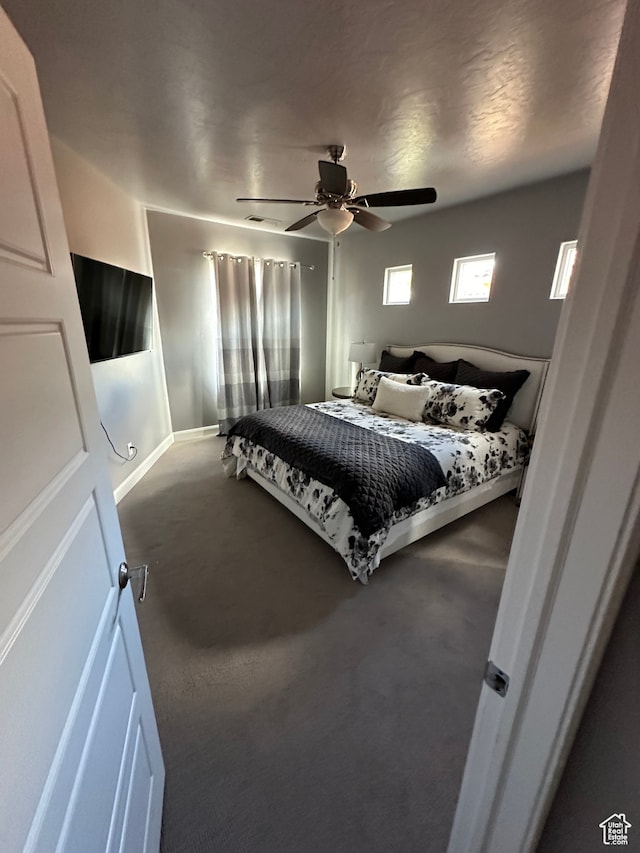 bedroom featuring baseboards and a ceiling fan
