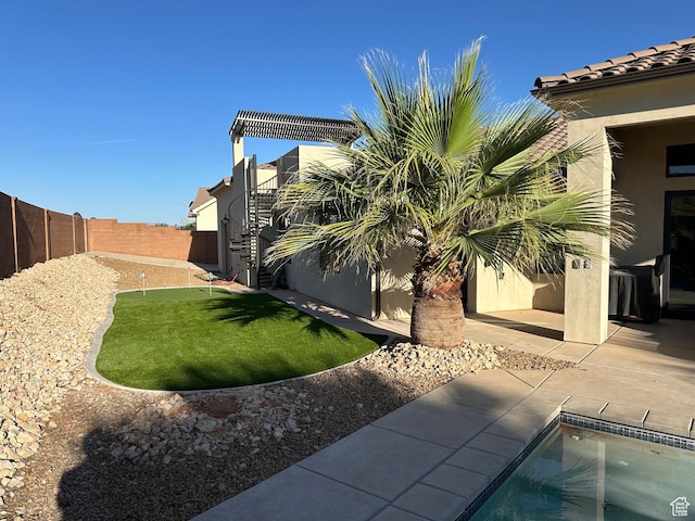 view of yard with a patio area and a fenced backyard