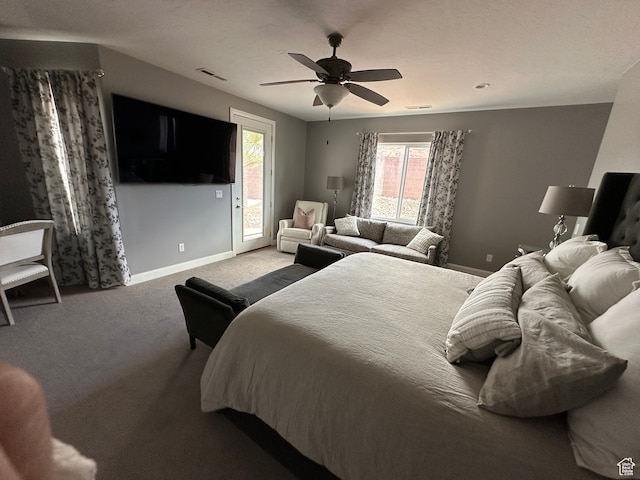 carpeted bedroom with a ceiling fan, access to exterior, baseboards, and visible vents