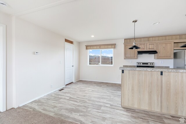 750 E 400 N Unit 220, Mount Pleasant, UT 84647 - kitchen featuring light brown cabinets, decorative light fixtures, stove, stainless steel refrigerator, and light wood-type flooring