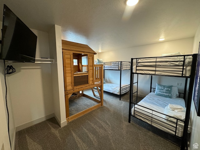 140 W 150 S Unit I32, Garden City, UT 84028 - bedroom with dark colored carpet and baseboards