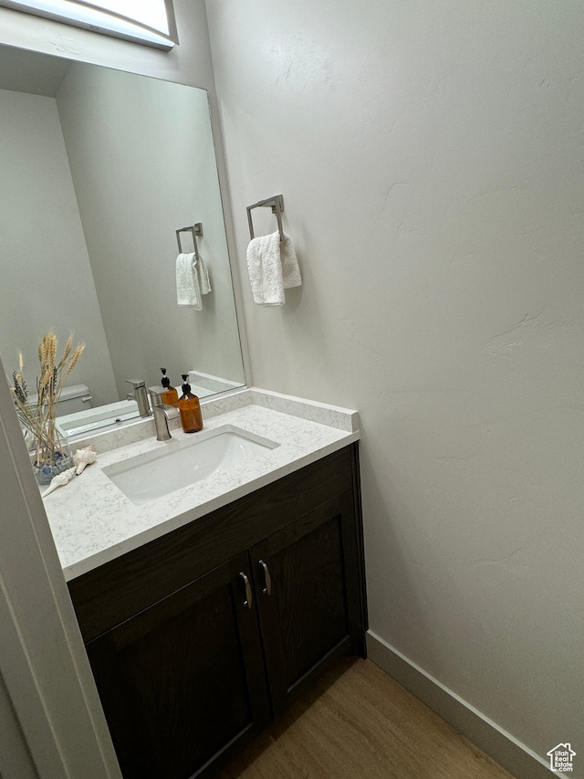140 W 150 S Unit I32, Garden City, UT 84028 - bathroom with toilet, wood finished floors, vanity, and baseboards