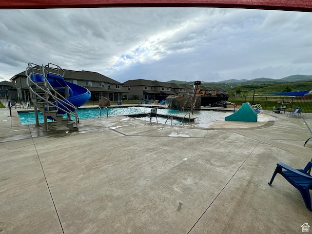 140 W 150 S Unit I32, Garden City, UT 84028 - pool with a patio area, fence, a mountain view, and a water slide
