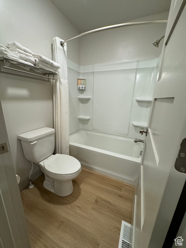 140 W 150 S Unit I32, Garden City, UT 84028 - full bathroom with shower / tub combo, visible vents, toilet, and wood finished floors