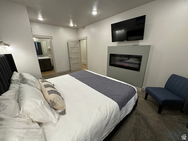 140 W 150 S Unit I32, Garden City, UT 84028 - bedroom featuring recessed lighting, a glass covered fireplace, baseboards, carpet, and ensuite bath
