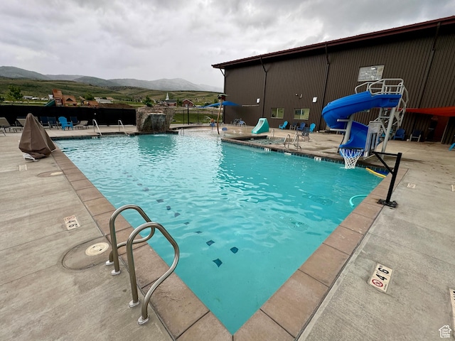 140 W 150 S Unit I32, Garden City, UT 84028 - pool with a mountain view, a water slide, and a patio