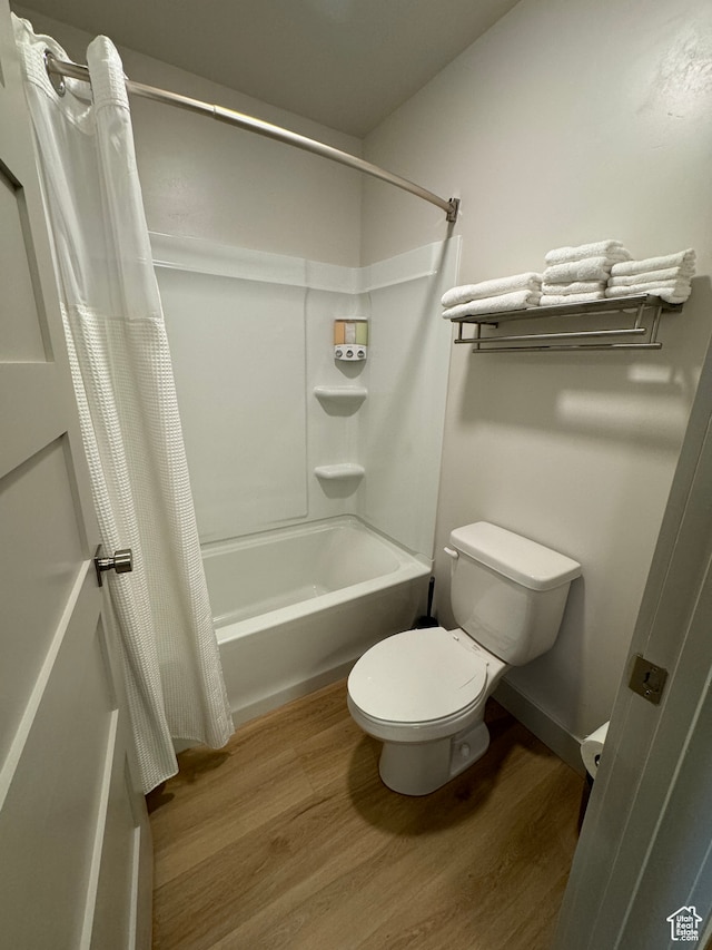 140 W 150 S Unit I32, Garden City, UT 84028 - full bathroom featuring shower / bath combo with shower curtain, wood finished floors, and toilet