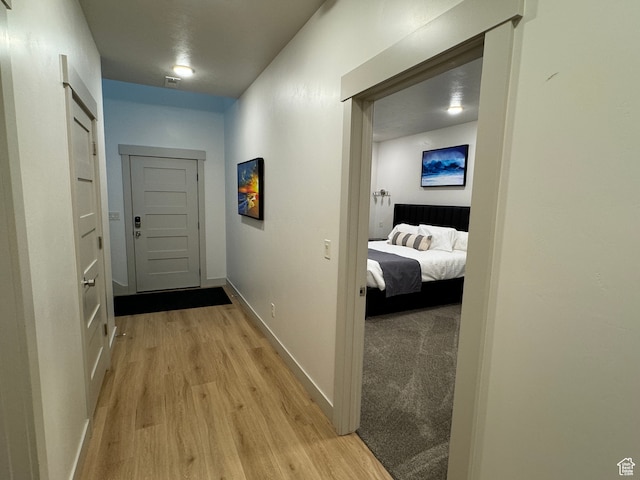 140 W 150 S Unit I32, Garden City, UT 84028 - hallway featuring light wood-type flooring, visible vents, and baseboards