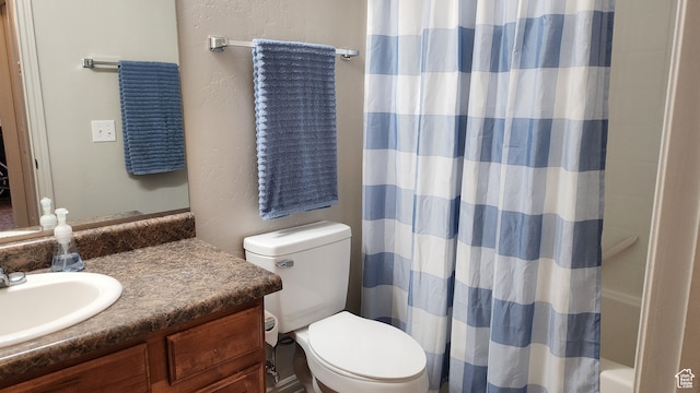 bathroom with oversized vanity and toilet