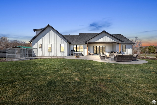 1429 S Hallam Rd Unit 2, Francis, UT 84036 - back house at dusk with outdoor lounge area, a yard, and a patio