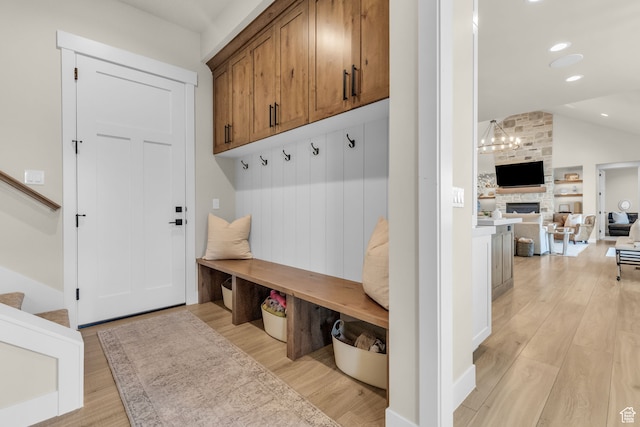 1429 S Hallam Rd Unit 2, Francis, UT 84036 - mudroom featuring lofted ceiling, light wood-type flooring, and a fireplace