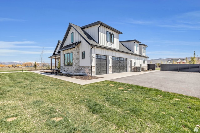 1429 S Hallam Rd Unit 2, Francis, UT 84036 - view of front of house with a garage and a front lawn
