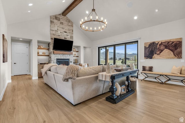 1429 S Hallam Rd Unit 2, Francis, UT 84036 - living room with high vaulted ceiling, a stone fireplace, light hardwood / wood-style floors, beam ceiling, and an inviting chandelier