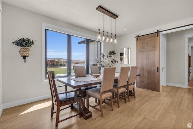 1429 S Hallam Rd Unit 2, Francis, UT 84036 - dining area with light hardwood / wood-style flooring and a barn door