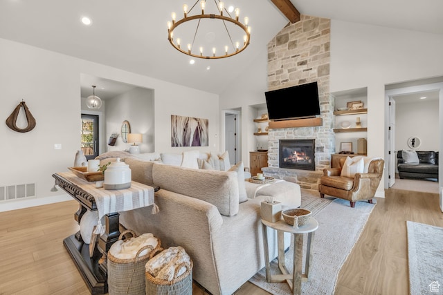 1429 S Hallam Rd Unit 2, Francis, UT 84036 - living room with beamed ceiling, a stone fireplace, high vaulted ceiling, a notable chandelier, and light hardwood / wood-style floors