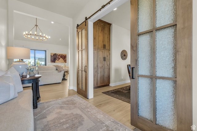 1429 S Hallam Rd Unit 2, Francis, UT 84036 - entrance foyer with a barn door, light hardwood / wood-style floors, and a notable chandelier