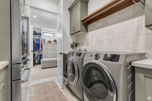 1429 S Hallam Rd Unit 2, Francis, UT 84036 - laundry area featuring washer and dryer, light tile flooring, and cabinets