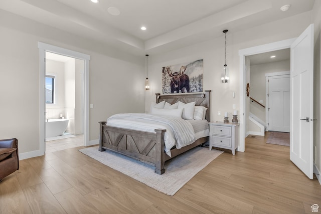1429 S Hallam Rd Unit 2, Francis, UT 84036 - bedroom with light wood-type flooring and ensuite bathroom