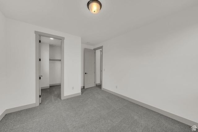 664 Pine Canyon Rd, St George, UT 84790 - unfurnished bedroom with light colored carpet, a closet, and a spacious closet