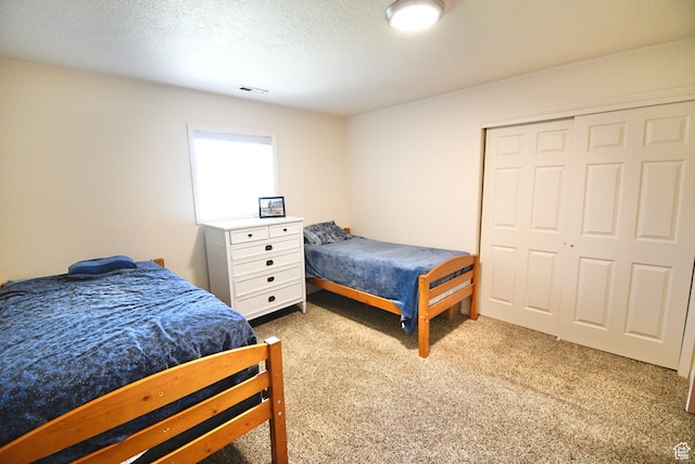 75 E 300 N, Glenwood, UT 84730 - bedroom with a textured ceiling, a closet, and carpet floors