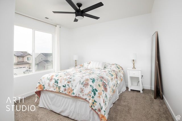 carpeted bedroom featuring ceiling fan