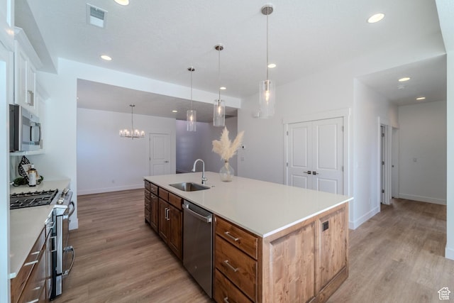 723 S 1220 W Unit 34, Hurricane, UT 84737 - kitchen with light wood finished floors, appliances with stainless steel finishes, a sink, and visible vents