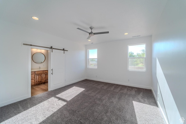 723 S 1220 W Unit 34, Hurricane, UT 84737 - unfurnished bedroom featuring a barn door, carpet, recessed lighting, and baseboards