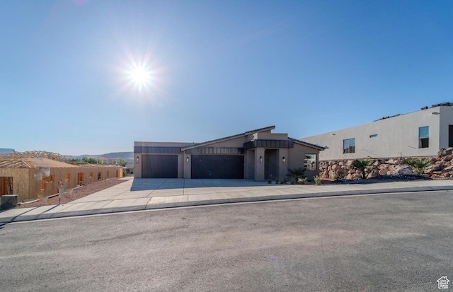 723 S 1220 W Unit 34, Hurricane, UT 84737 - view of front of house with a garage, driveway, and stucco siding