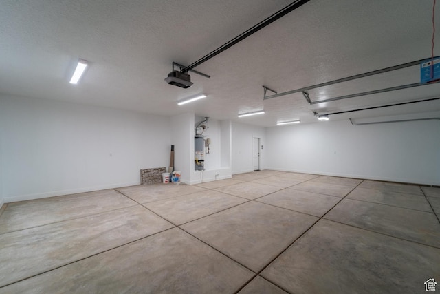 723 S 1220 W Unit 34, Hurricane, UT 84737 - garage with water heater, baseboards, and a garage door opener